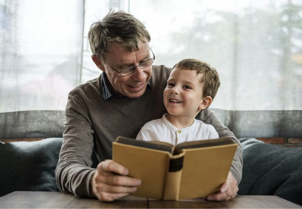 Grandfather Grandson Reading Book Together