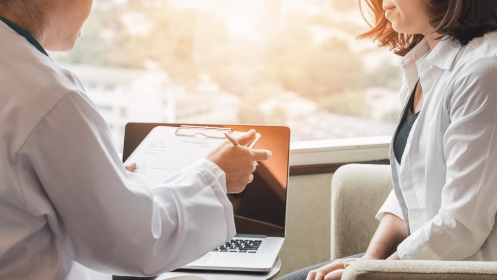 Doctor Patient Discussing Hpv Breast Cancer