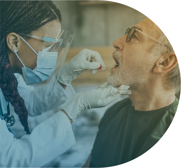 Nurse doing a saliva swab on a man.