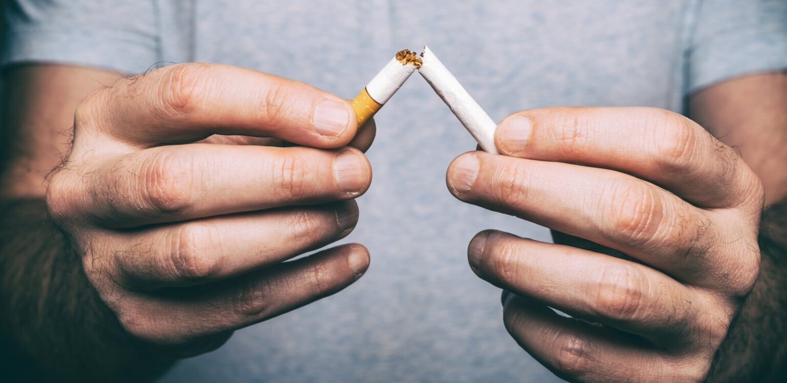 Quitting Smoking Male Hand Crushing Cigarette