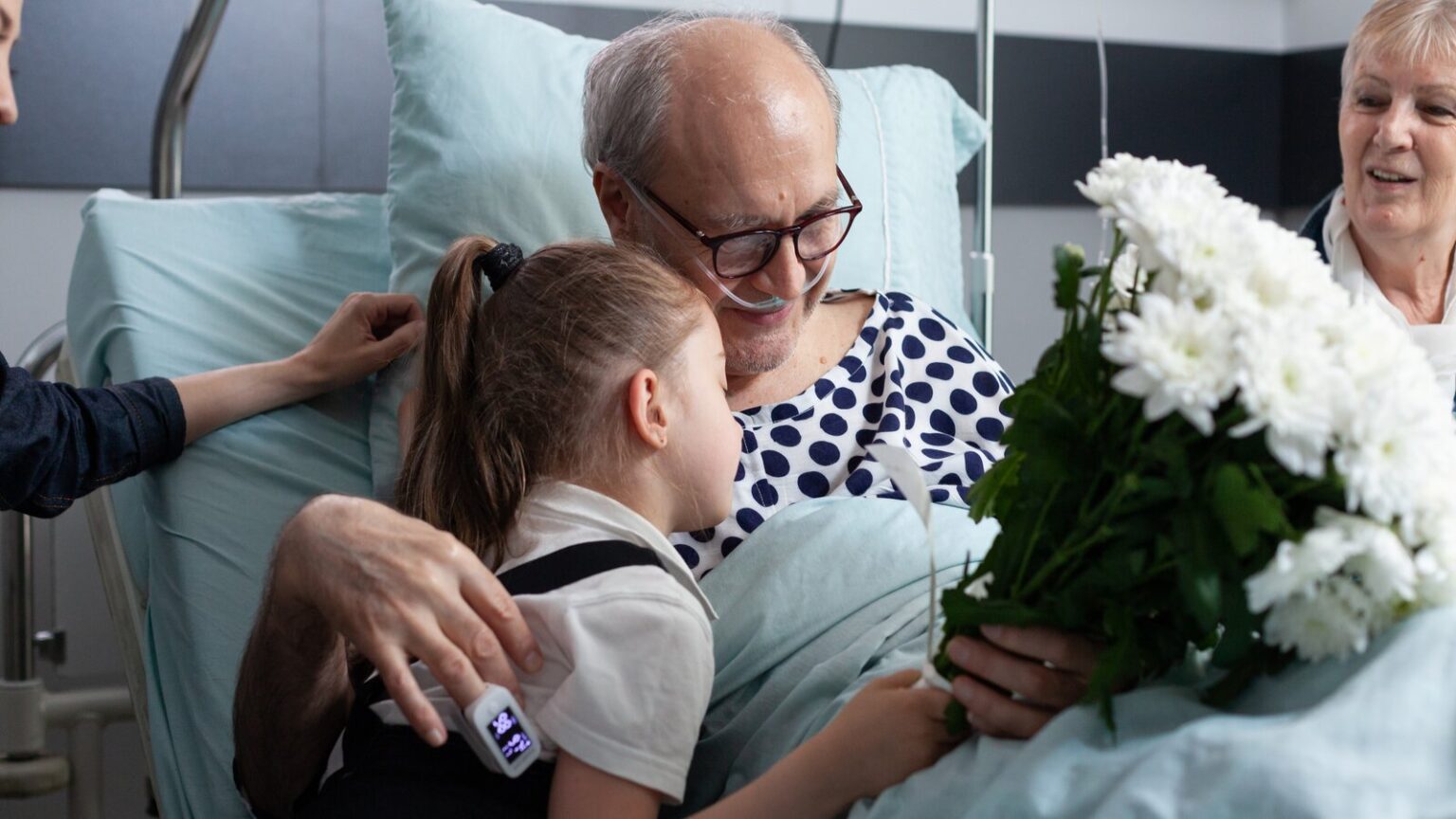 Bedridden Patient Receiving Gift From Relatives