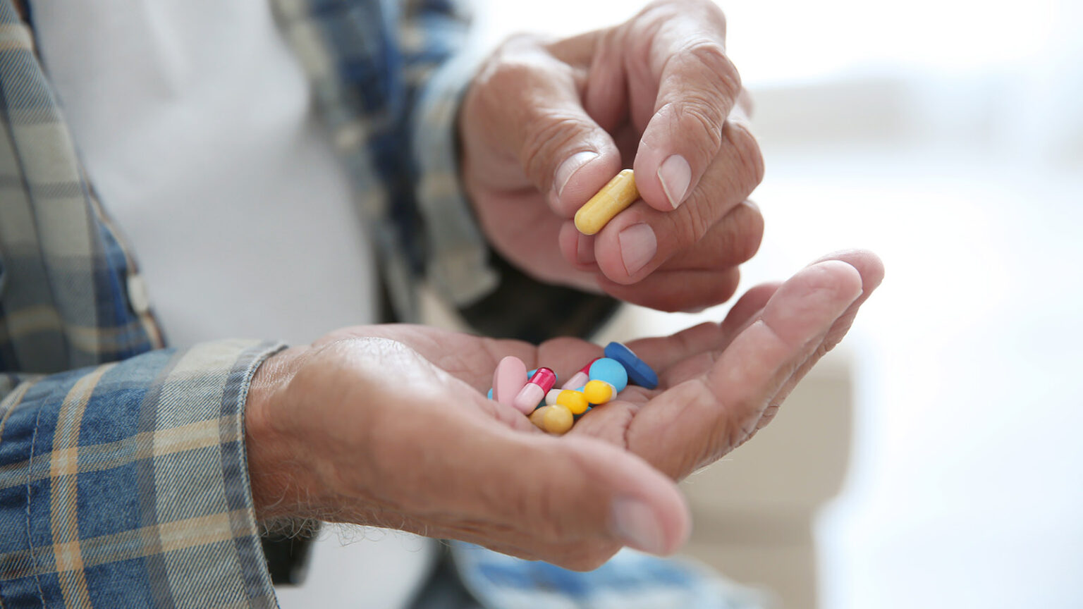 Senior Man Taking Pills, Closeup