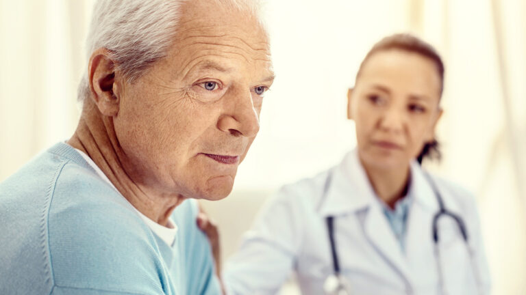 Pensive Retired Man Looking Upset During Medical Consultation